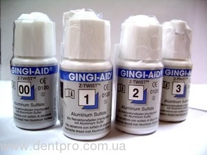 Джинджи-Эйд (Gingi-Aid), ретракционная нить пропитаная сульфатом алюминия , колба с лезвием, длина 274см